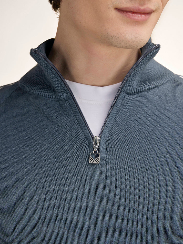 Dale of Norway Men's Geilo Sweater in Steel Offwhite, a sporty Norwegian quarter-zip sweater made from 100% skin-soft merino wool.