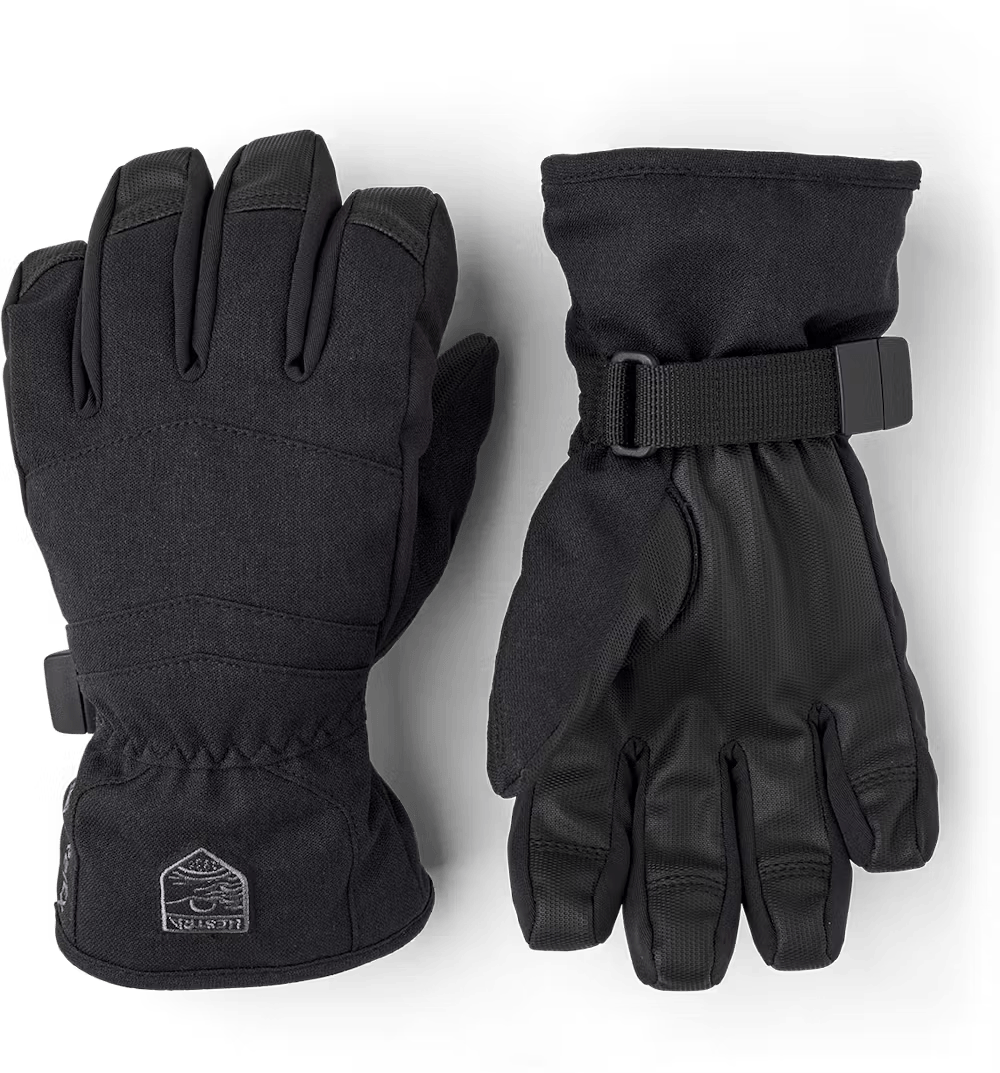 A pair of black Hestra Jr Atlas GORE-TEX Gloves taht are designed to keep your child's hands warm and dry in harsh winter conditions.