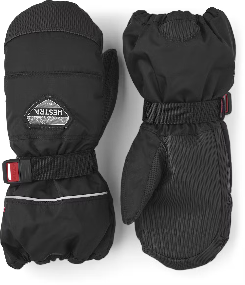 A pair of black Hestra Jr CZone Mittens that are designed to keep your child's hands warm and dry in harsh winter conditions.