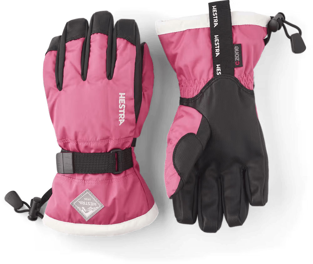 A pair of pink Hestra Jr Gauntlet CZone Gloves that are designed to keep your child's hands warm and dry in harsh winter conditions.