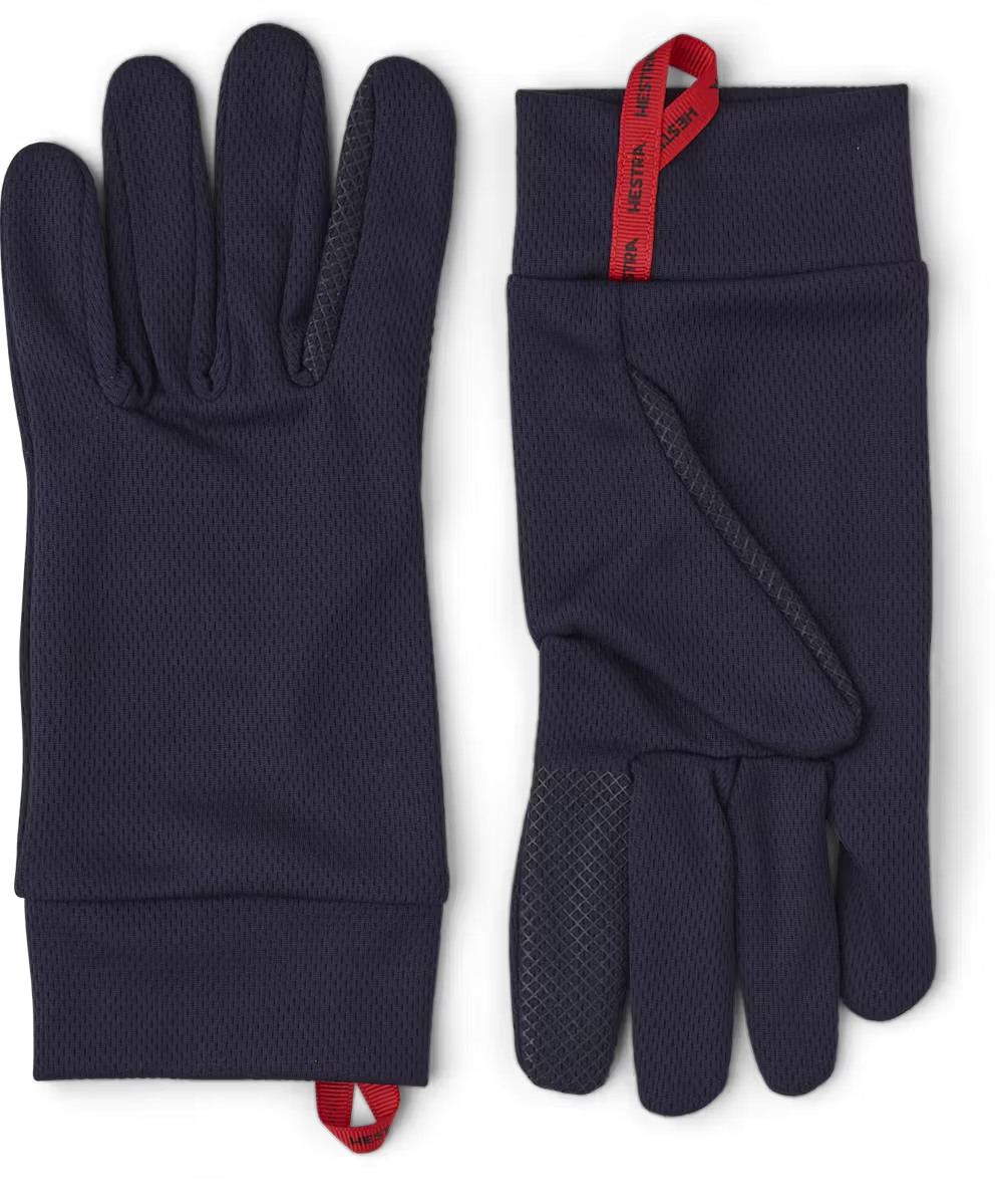 A pair of black Hestra Junior Touch Point Dry Wool Glove Liners that show off the touch screen-friendly surface of the fingertips.