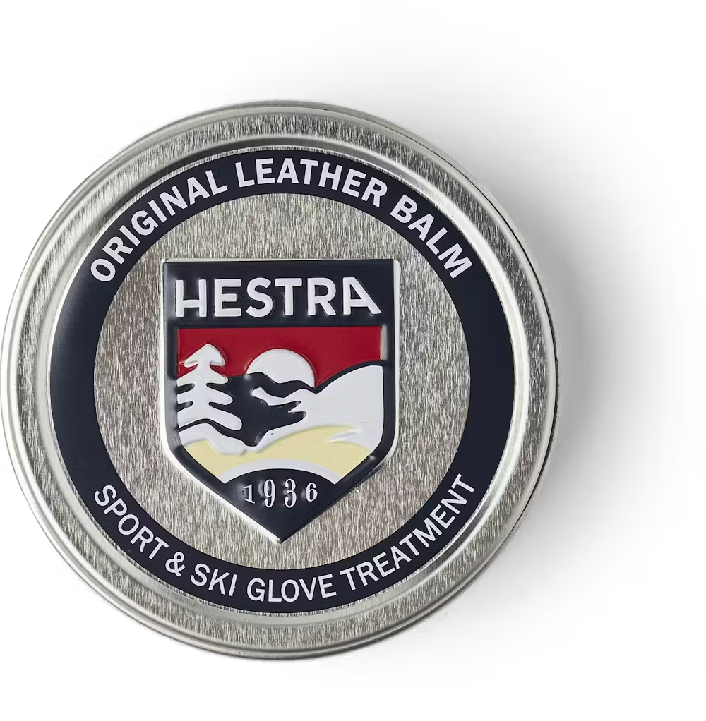 A container of Hestra Leather Balm, which is designed to keep leather gloves and mittens in pristine condition.
