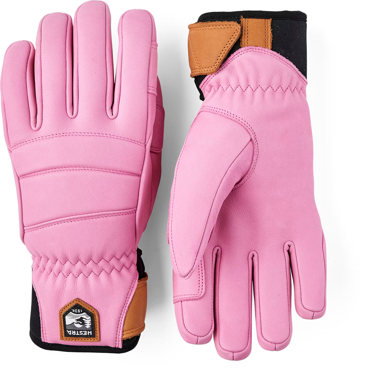 A pink Hestra Women's Fall Line Glove that is made from premium leather.