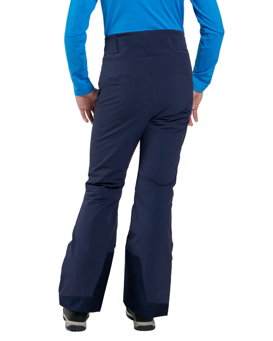 Rear view of Atlanta Blue Kjus Jr Girls’ Whiteout Pants featuring 2-layer waterproof fabric, Fast Thermo Core insulation, water-repellent zippers, reinforced scuff guards, and the KJUS-GROW leg extension system.