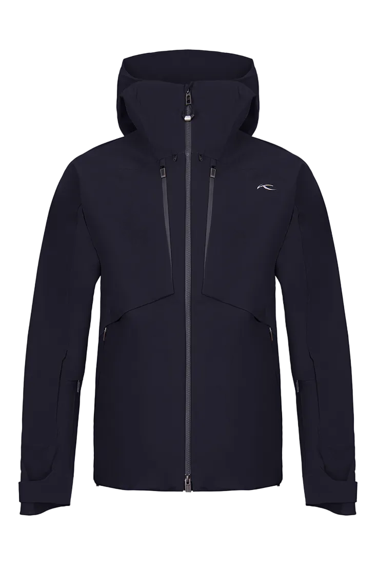 Front view of a black Kjus Men’s Frx Lucas Shell Jacket featuring 3-layer waterproof membrane fabric, water-repellent zippers, AC-Vent ventilation ports, and an adjustable helmet-compatible hood.