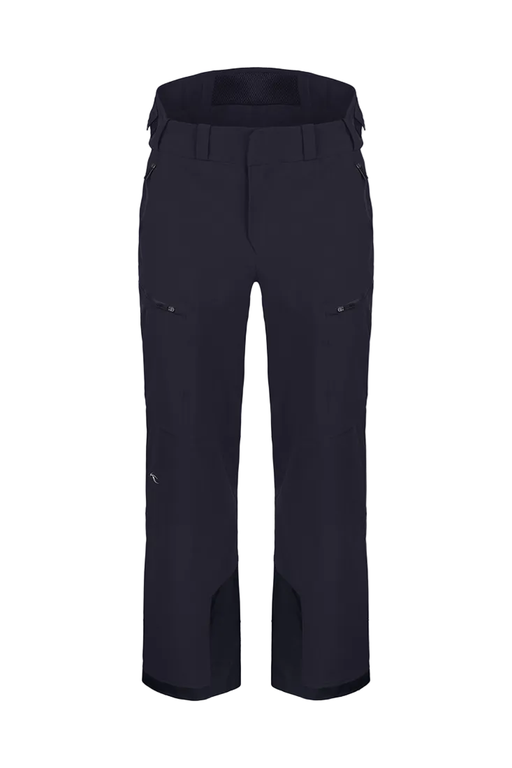 Front view of black Kjus Men’s FRX Lucas Shell Pants featuring 3-layer waterproof stretch fabric, zippered outer thigh vents, water-repellent zippers, and Schoeller Keprotec reinforced scuff guards.