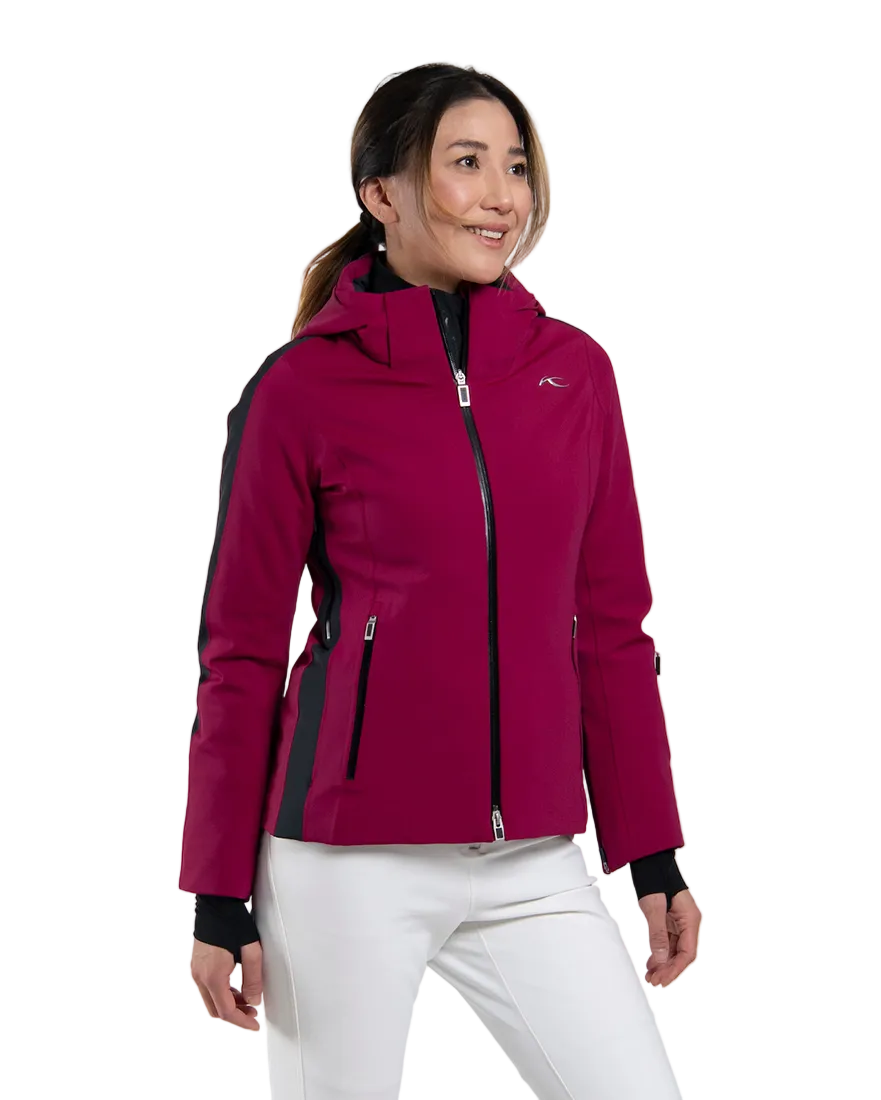 Front view of a velvet rouge/black Kjus Women’s Formula Jacket featuring 4-way stretch waterproof fabric, Fast Thermo Core insulation, water-repellent zippers, AC-Vent forearm ports, and a detachable helmet-compatible hood.