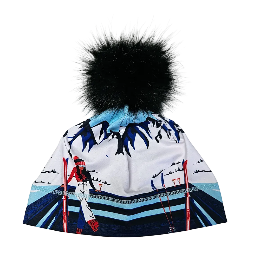 A photo of the Krimson Klover Apres Anyone Beanie featuring a fine-gauge ECOVERO™ viscose blend knit, interior fleece earband lining, folded ribbed cuff, custom graphic motif, and faux-fur pom topper.