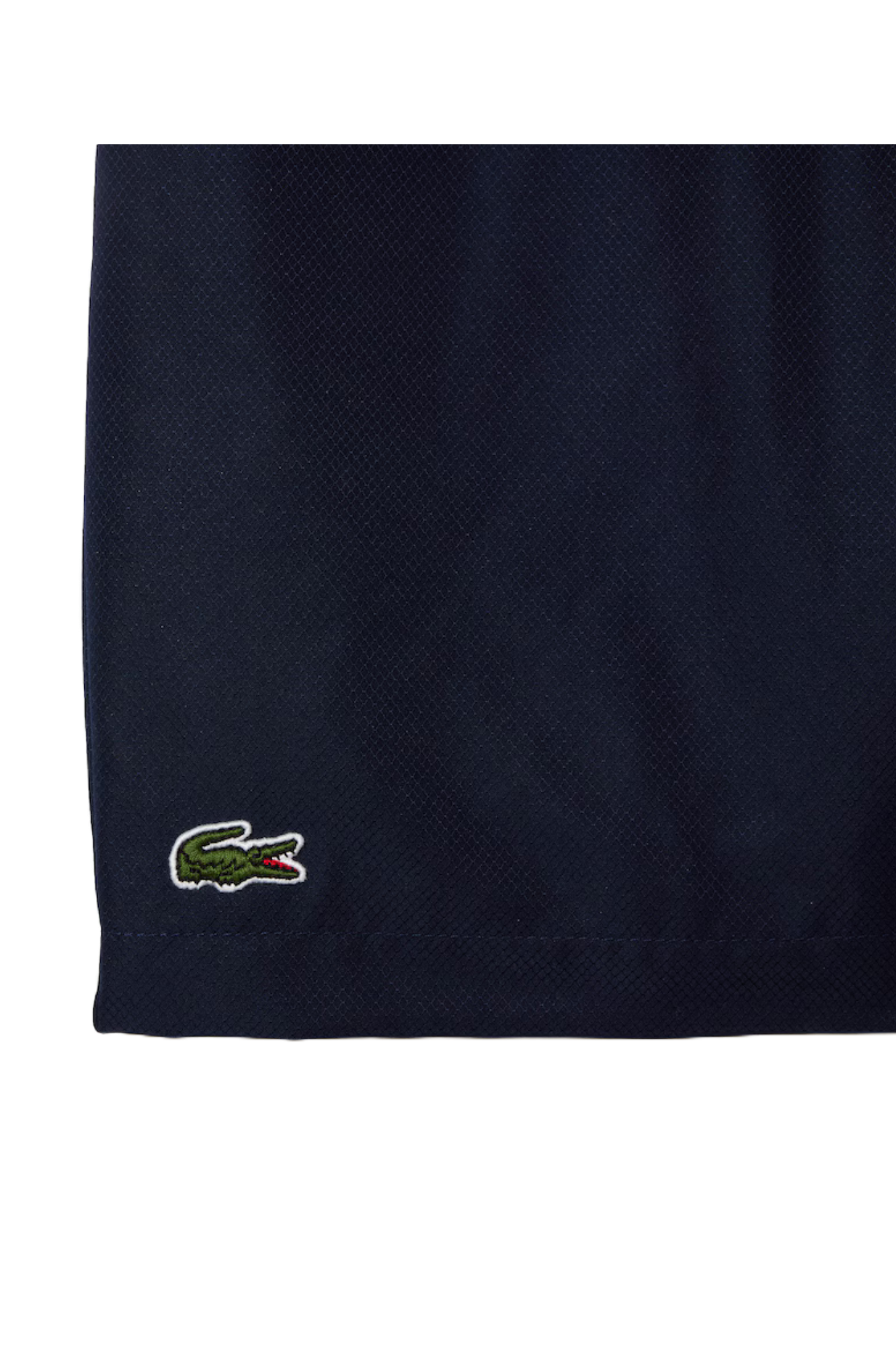 Lacoste Boys Sport Diamond Weave Shorts featuring lightweight breathable fabric, athletic fit, elastic waistband, and crocodile branding.