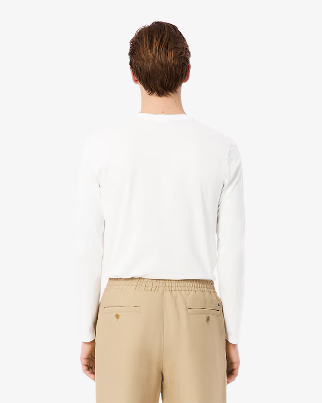 Lacoste Men's Crew Neck Pima Cotton Jersey Long Sleeve T-Shirt featuring premium Pima cotton, soft comfort, classic styling, and crocodile branding.