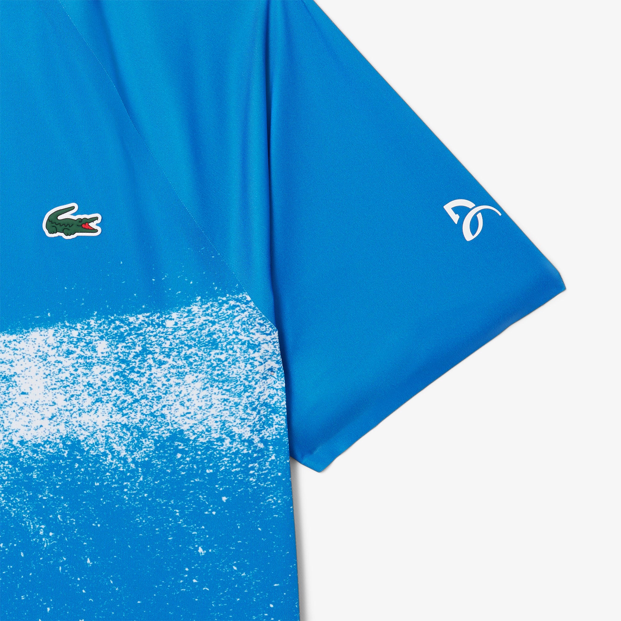 Lacoste Men's Tennis x Novak Djokovic On-Court Polo featuring breathable performance fabric, athletic fit, and signature collection detailing.