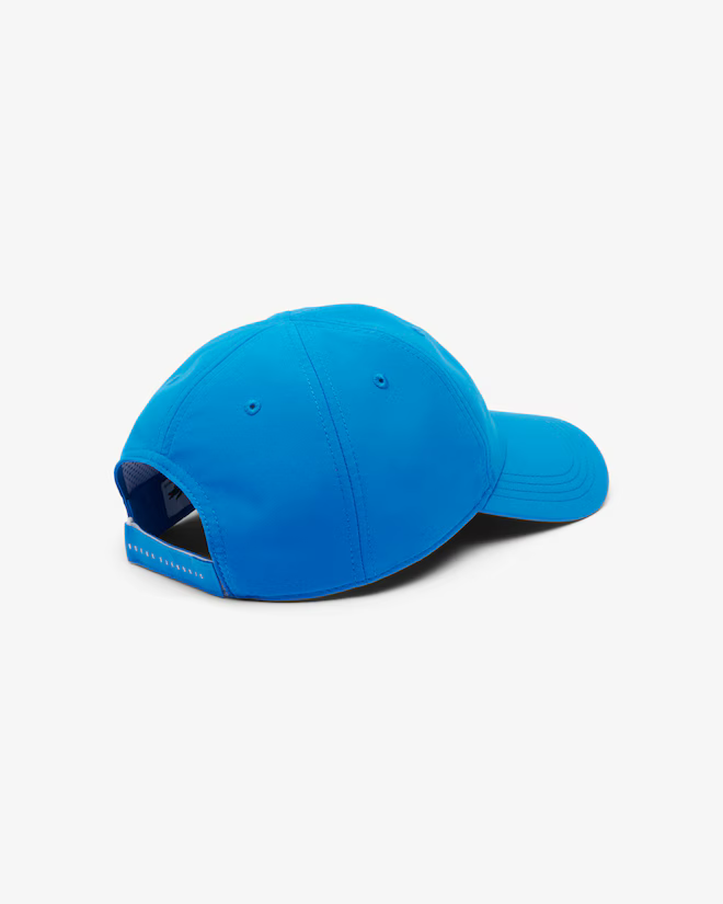 Lacoste Sport x Novak Djokovic Tennis Cap featuring lightweight performance fabric, breathable comfort, an adjustable fit, and signature branding.