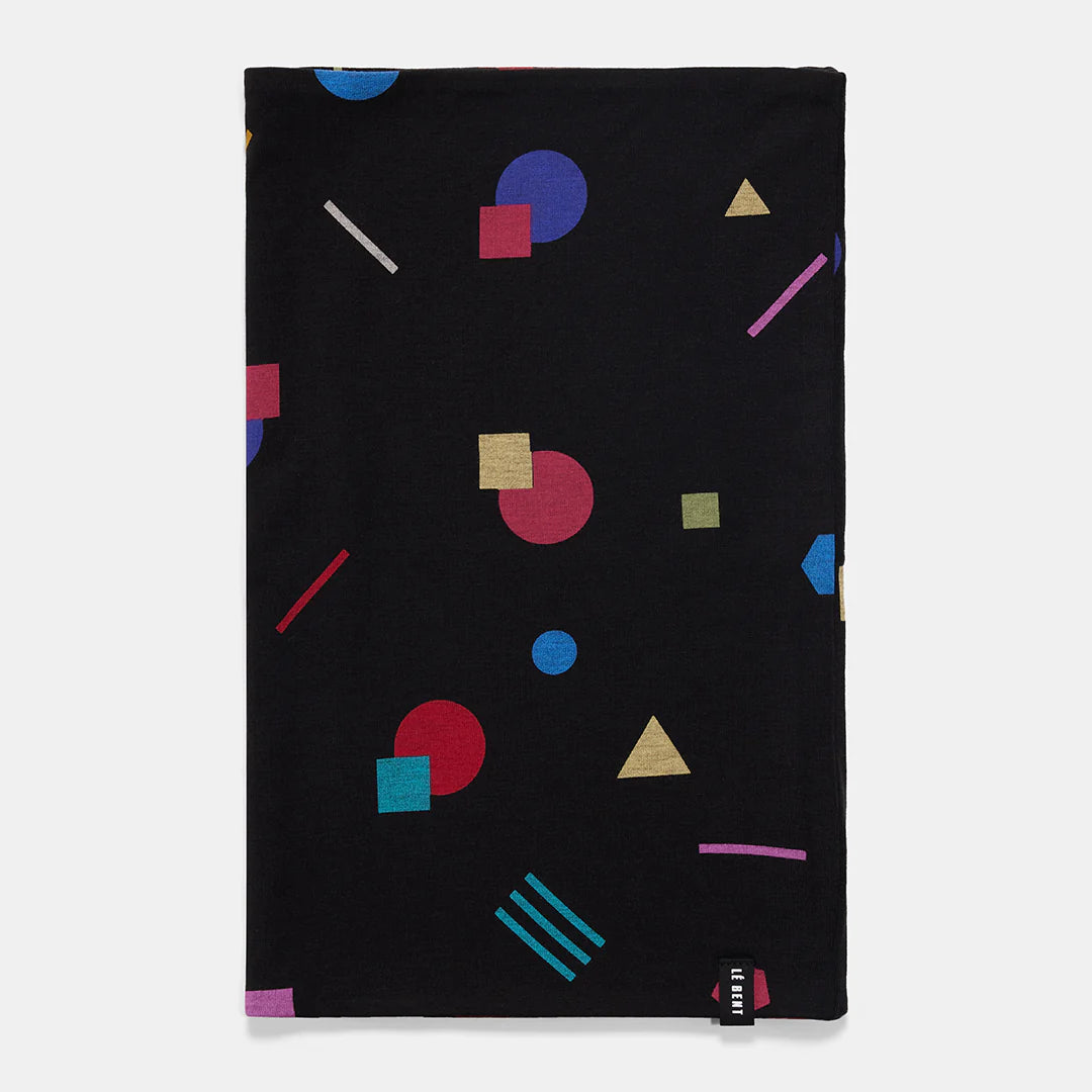 A black Le Bent Kids' Confetti Midweight Neck Gaiter that features a colourful geometric pattern.