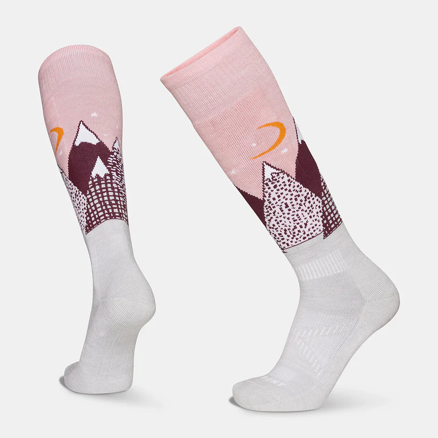 A pair of pink Le Bent Kids' Snowy Mountains Light Cushion Ski Socks that are designed to keep your child's feet warm in harsh winter conditions.