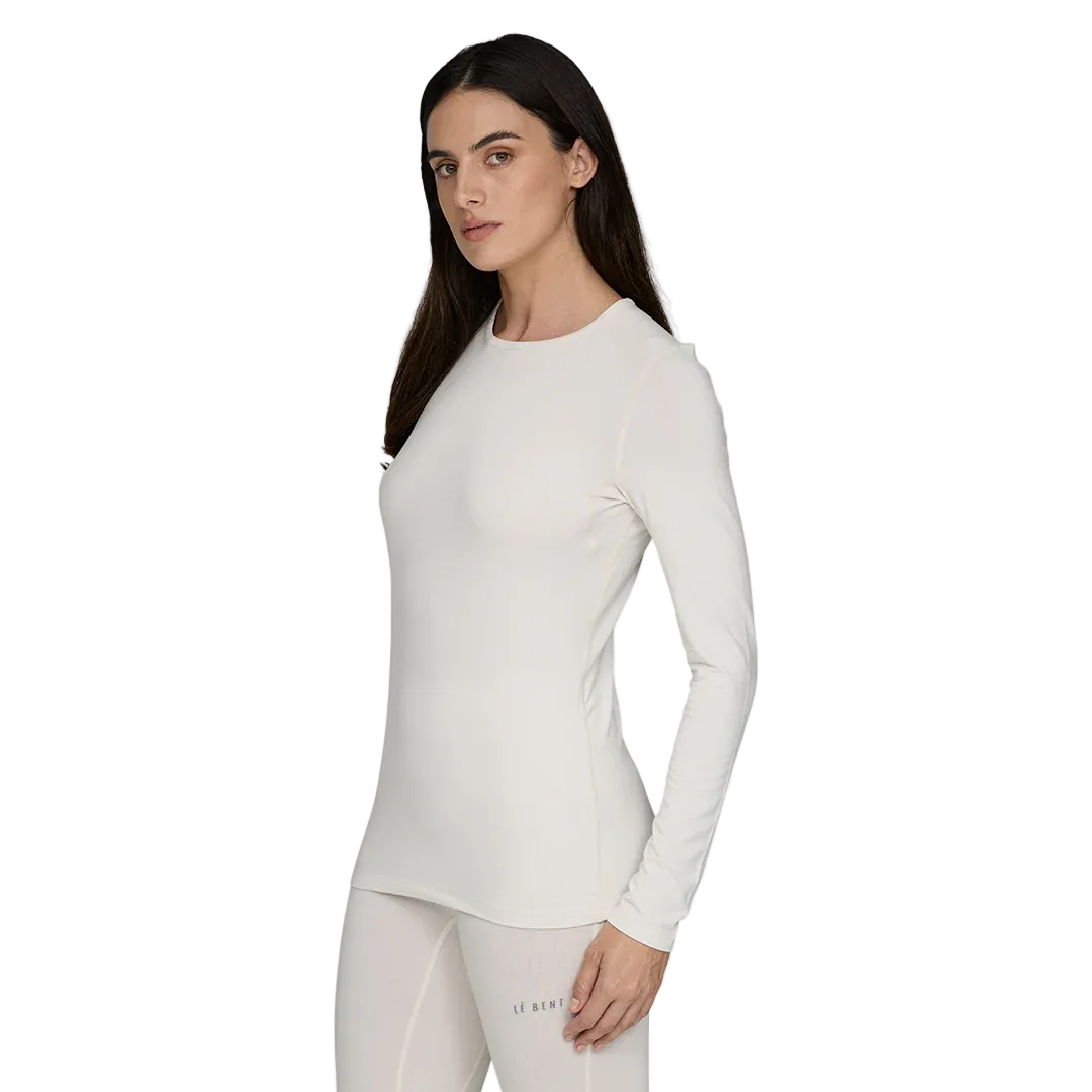 A white Le Bent Women's Core Midweight Crewneck Baselayer Top that is made from a bamboo and merino wool blend.