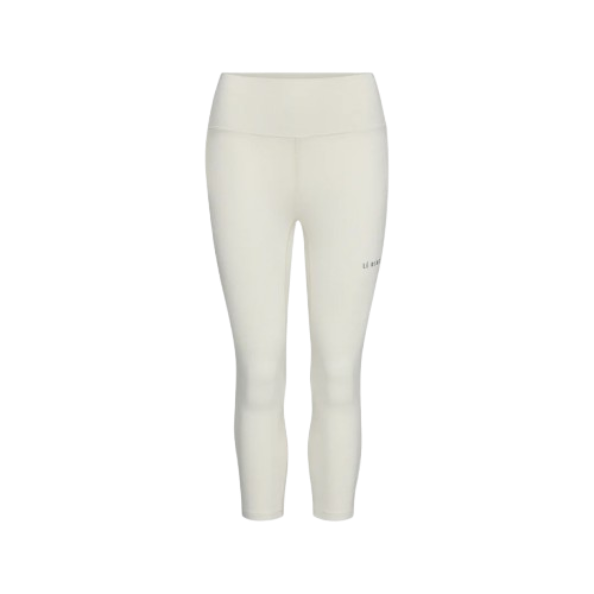 A pair of white Le Bent Women's Core Midweight 3/4 Length Baselayer Bottoms that are made from a bamboo and merino wool blend.