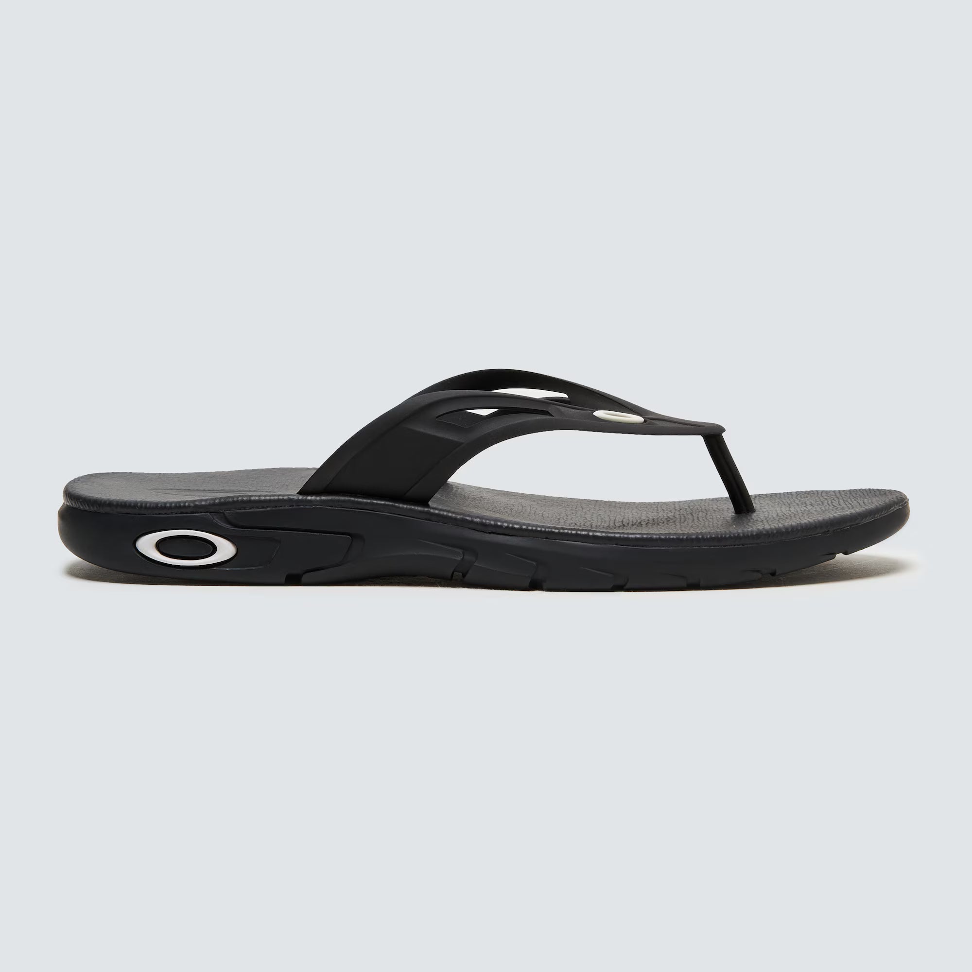 A black Oakley Ellipse Flip flip-flop sandal on a white background