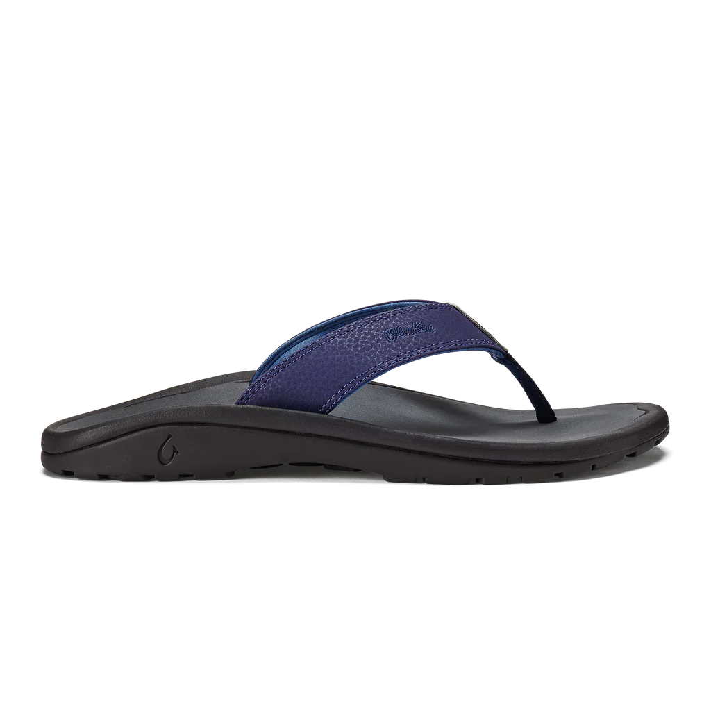 Blue and black Olukai Junior Boys Ohana flip-flop sandal on a white background