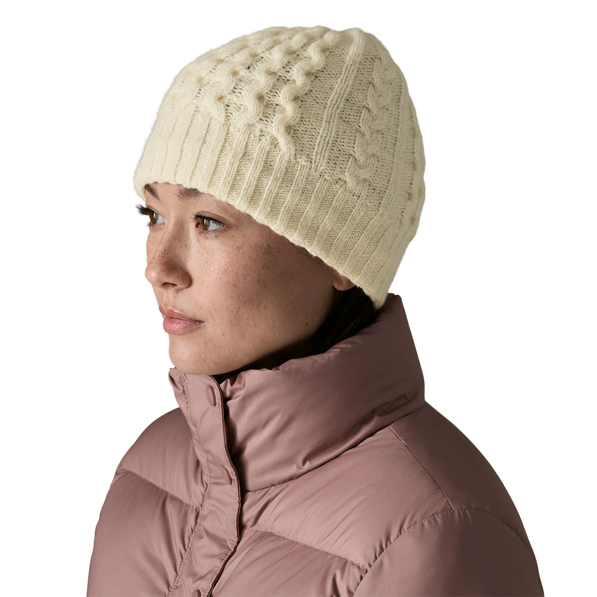 Front view of a birch white Patagonia Coastal Cable Beanie featuring a recycled wool blend cable-knit body, an interior recycled polyester fleece headband lining, and a low-profile fit.