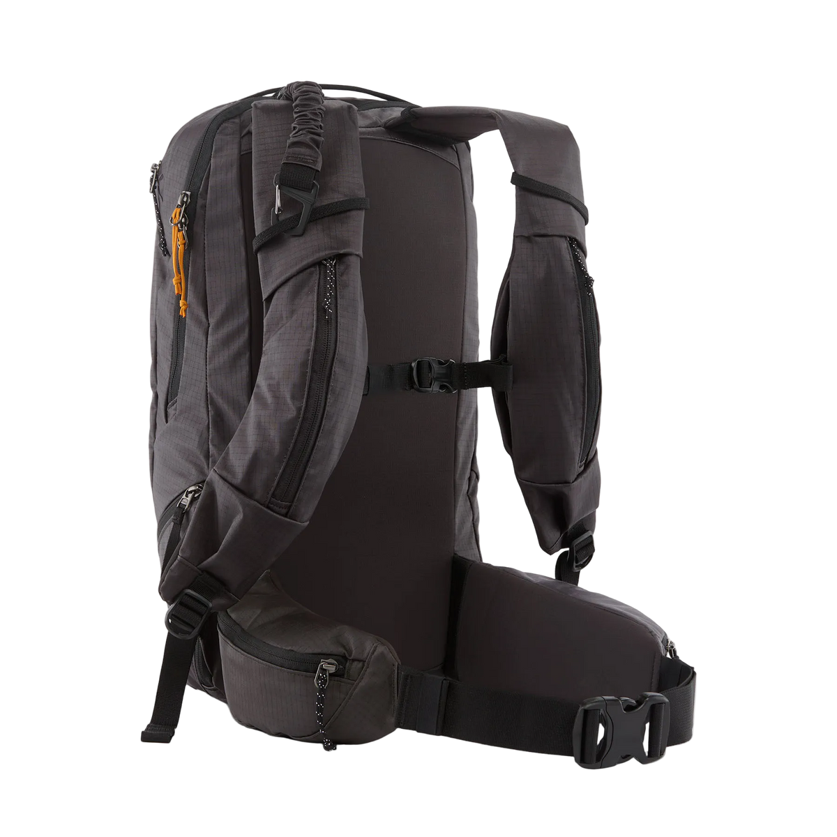 Rear view of a black Patagonia SnowDrifter Pack 20L featuring weather-resistant recycled nylon ripstop fabric, diagonal ski and vertical snowboard carry loops, a front avalanche safety gear pocket, fleece-lined top goggle pocket, and shoulder harness accessory pockets.