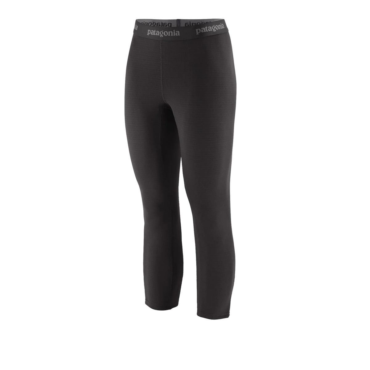 Front view of the black Patagonia Women's Capilene Thermal Weight Boot Length Baselayer Bottoms featuring a 3/4 boot-length hem, Polartec Power Grid fabric with an open-grid brushed interior, a flat elastic waistband, a gusseted crotch, and flatlock seam construction.