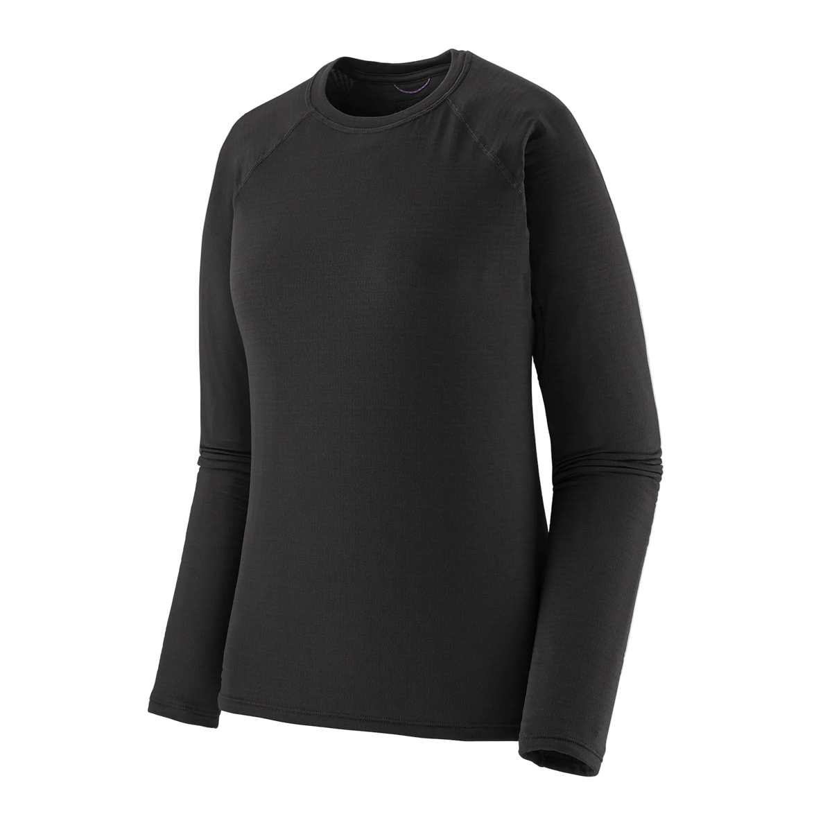 Front view of the black Patagonia Women's Capilene Thermal Weight Crew Baselayer featuring Polartec Power Grid fabric with an open-grid brushed interior, a self-fabric crewneck, offset shoulder seams, full underarm gussets, flatlock seam construction, elastic thumb loops, and a subtle drop-tail hem.