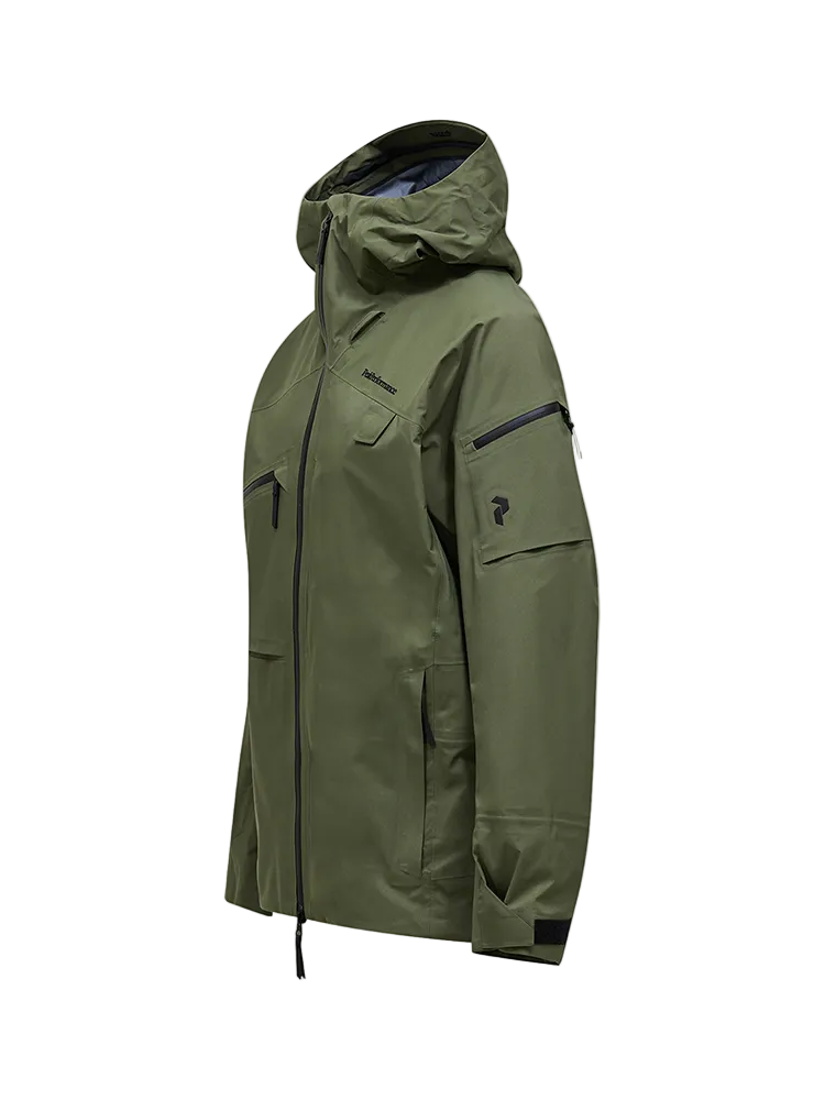 Side view of a pine needle green Peak Performance Men's Alpine GORE-TEX C-Knit 3L Shell Jacket featuring 3-layer GORE-TEX fabric with C-KNIT backer technology, YKK AquaGuard zippers, a 2-way adjustable helmet-compatible hood, and two-way underarm pit zips.