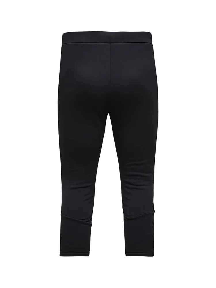 Rear view of black Peak Performance Men's Rider Essentials 3/4 Midlayer Pants featuring 4-way stretch technical fleece, a boot-compatible 3/4 leg length, flatlock seams, and a low-profile elastic waistband.