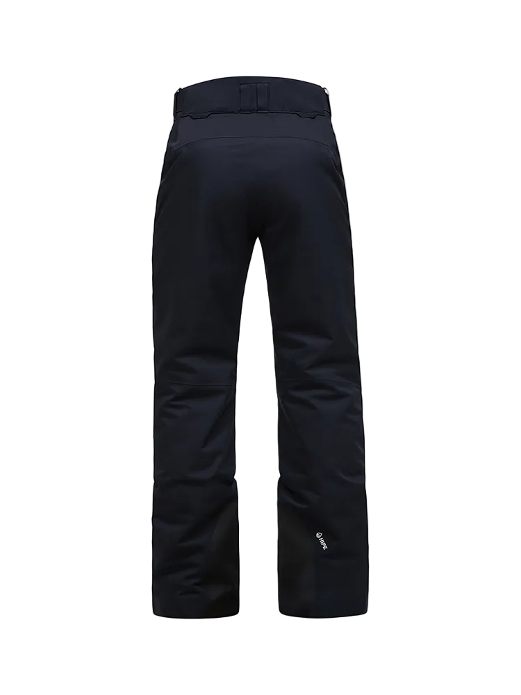 Rear view of black Peak Performance Women's Anima HIPE 2L Insulated Shell Pants featuring 2-layer HIPE 2-way stretch fabric, YKK AquaGuard zippered thigh vents, an adjustable velcro waistband, and reinforced lower leg scuff guards.