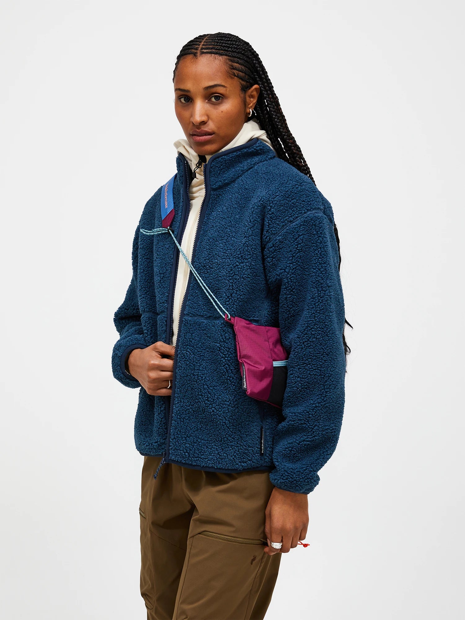 Peak Performance Women's Solid Pile Jacket featuring soft high-pile fleece, full-zip design, zippered pockets, and a women's-specific fit for winter adventures.