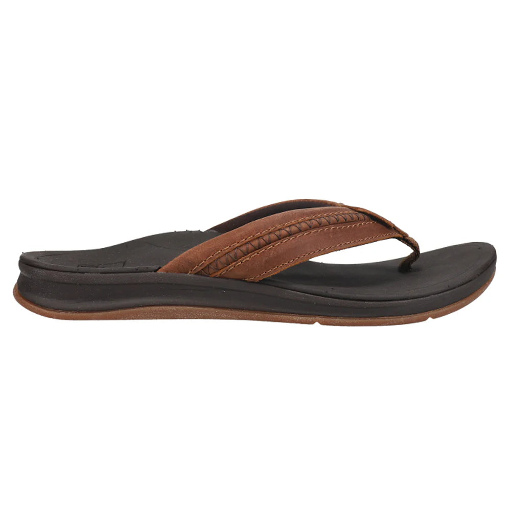 Brown and black Reef Mens Leather Ortho Bounce Coast flip-flop sandal on a white background