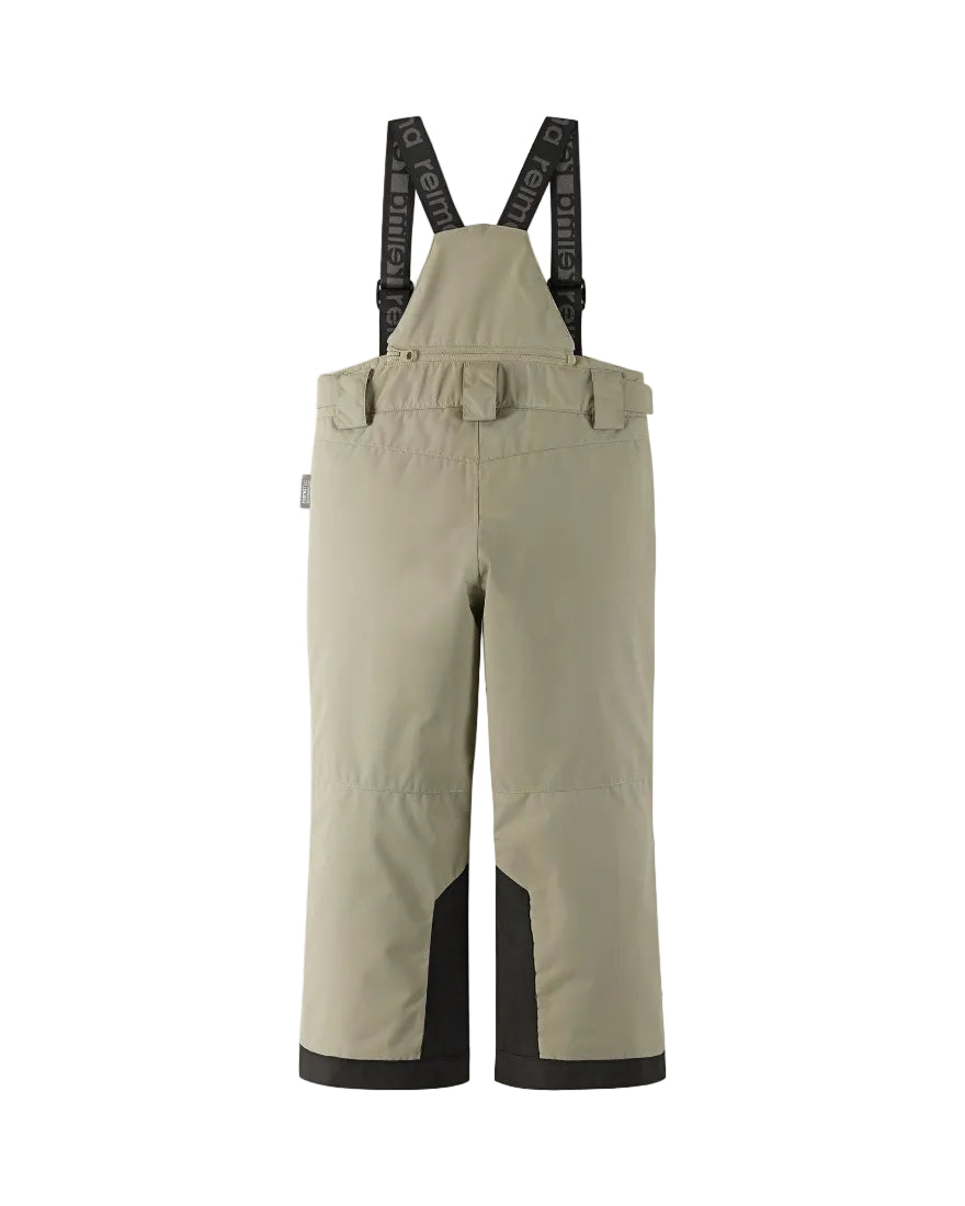 Rear view of beige Reima Jr Wingon Pants featuring a waterproof Reimatec shell, detachable elastic suspenders, reinforced knee and hem panels, and zippered hand pockets.