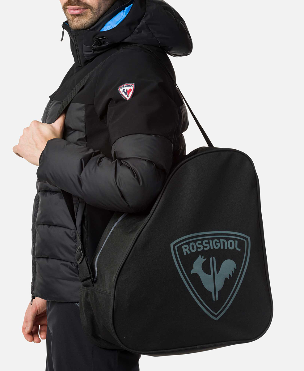 Rossignol Basic Boot Bag featuring a zippered ski boot compartment, durable construction, carrying handle, and Rossignol logo detailing.