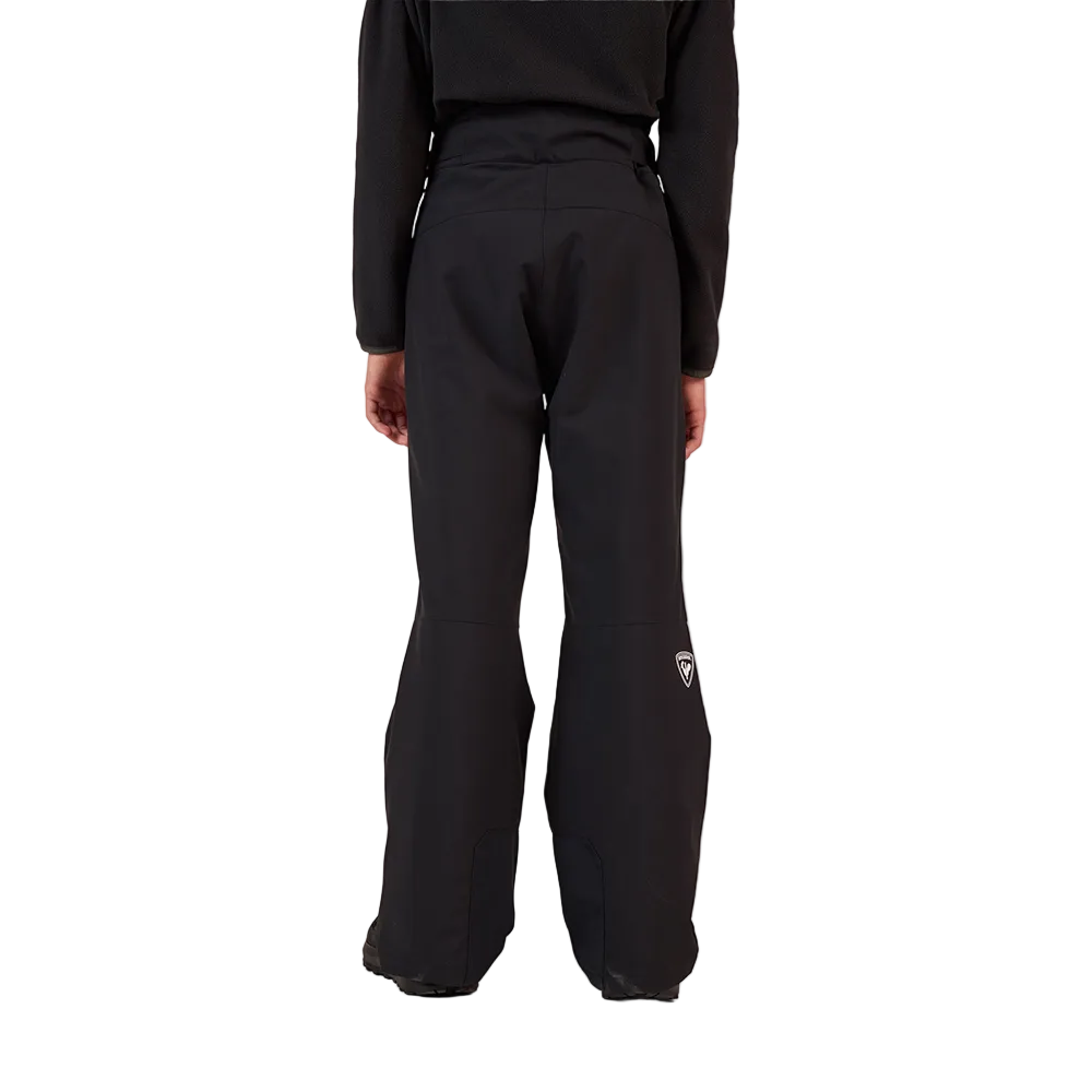 Rear view of the black Rossignol Jr Boys’ Insulated Ski Pants featuring waterproof membrane fabric, synthetic insulation, adjustable waist tabs, integrated boot gaiters, and reinforced hem scuff guards.