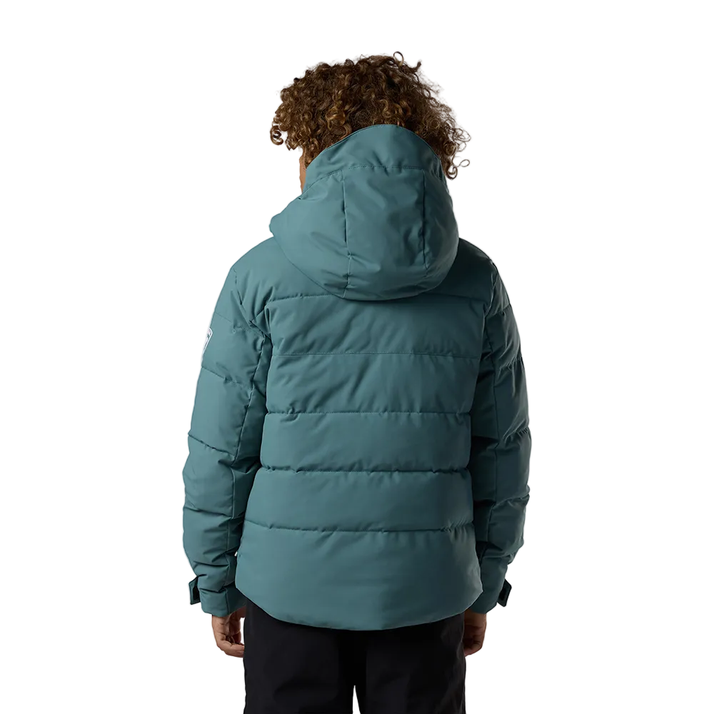 Rear view of a blue Rossignol Jr Boys’ Siz Quilted Jacket featuring high-loft synthetic insulation, quilted baffle construction, DWR-treated shell, high stand-up collar, and zippered handwarmer pockets.