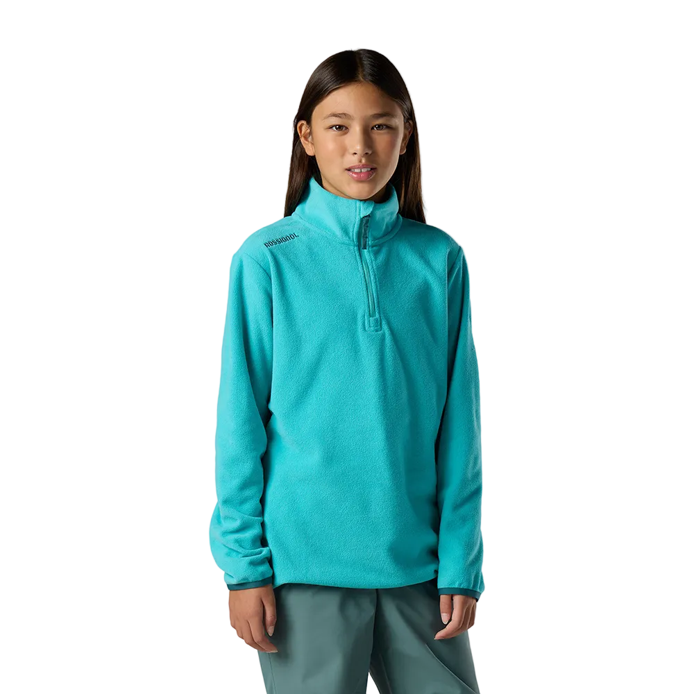 Front view of a baltic Rossignol Jr 1/4 Zip Polar Fleece featuring high-density microfleece construction, deep 1/4 zip front closure, and an ergonomic stand-up collar.