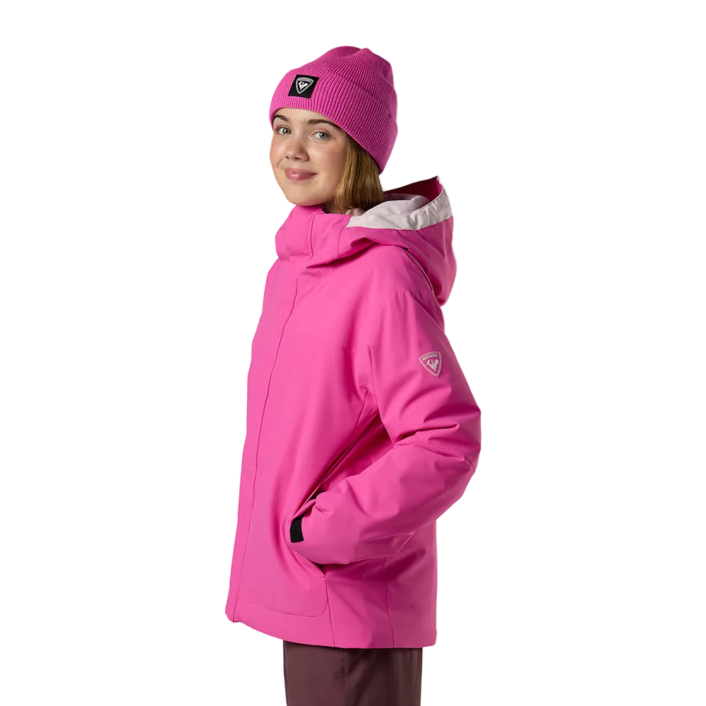 Side view of an electric fuschia Rossignol Jr Strawpile Insulated Jacket featuring waterproof membrane fabric, body-mapped recycled synthetic insulation, adjustable hood, integrated powder skirt, and zippered sleeve pass pocket.