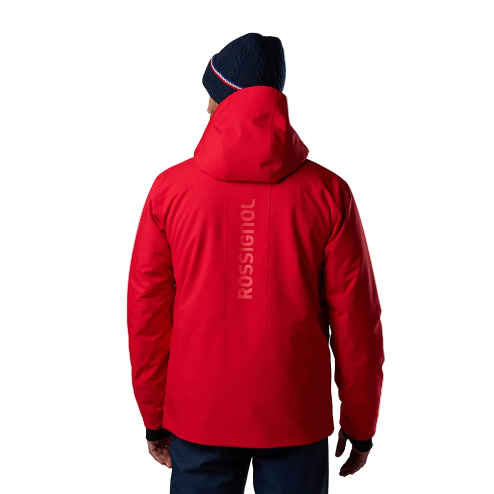 Rear view of a red Rossignol Men’s Rochrun Insulated Jacket featuring waterproof membrane fabric, synthetic insulation, helmet-compatible hood, and zippered underarm pit vents.