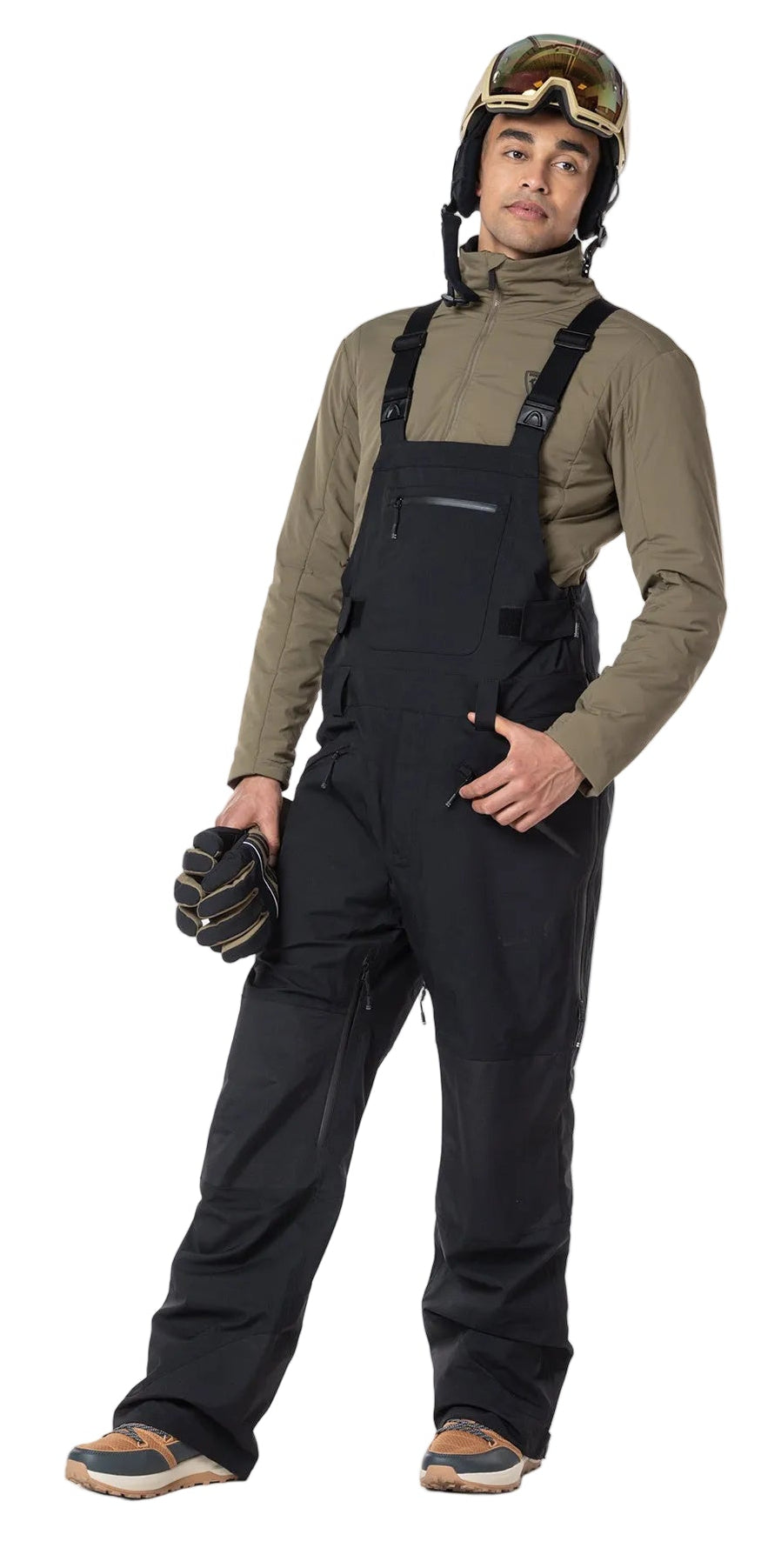 A man wearing a pair of black Rossignol Men's SKPR 3L AYR Bib Pants that are waterproof, breathable, stretchable, and warm.