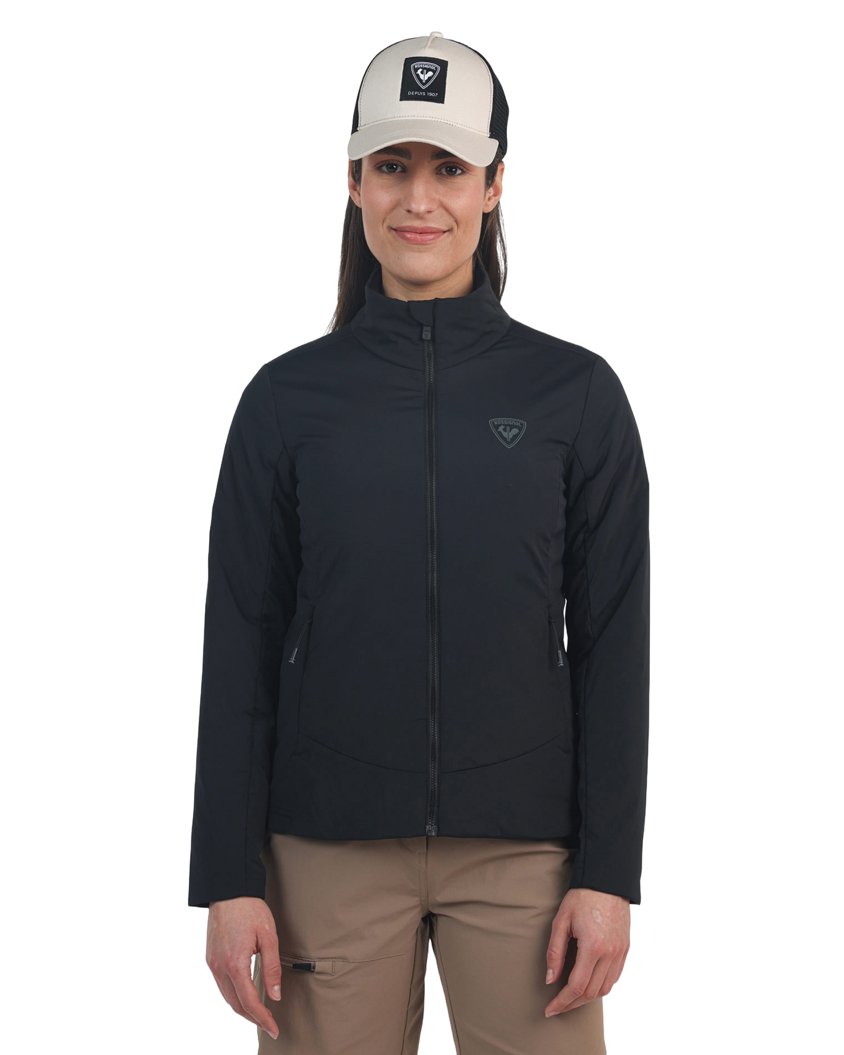 A woman wearing a black Rossignol Women's Opside Jacket that is water-resistant, breathable, stretchable, insulated, and lightweight.