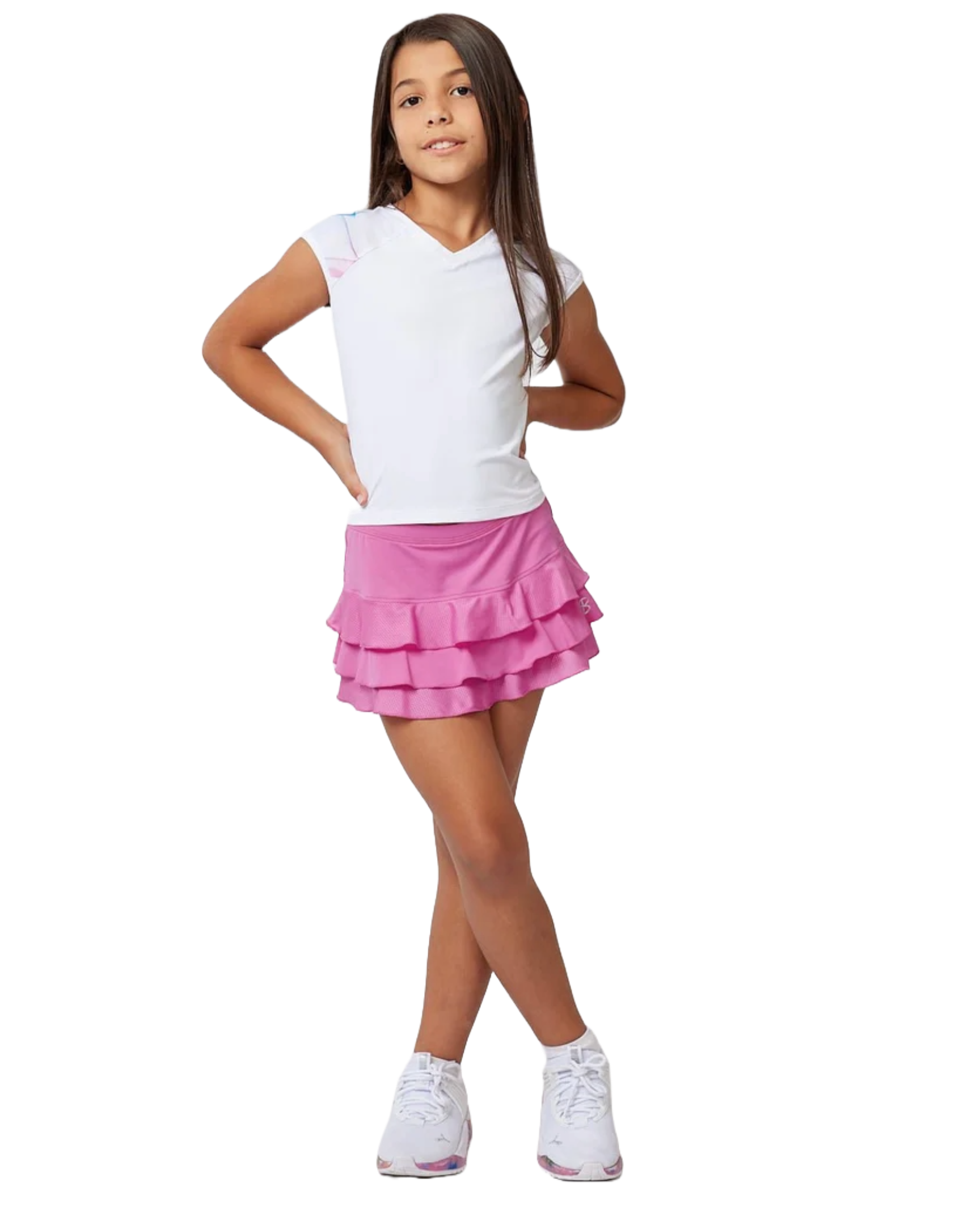 A girl wearing a white Sofibella Girls Spectrum Raglan Cap Sleeve Top and a pink skirt on a white background.
