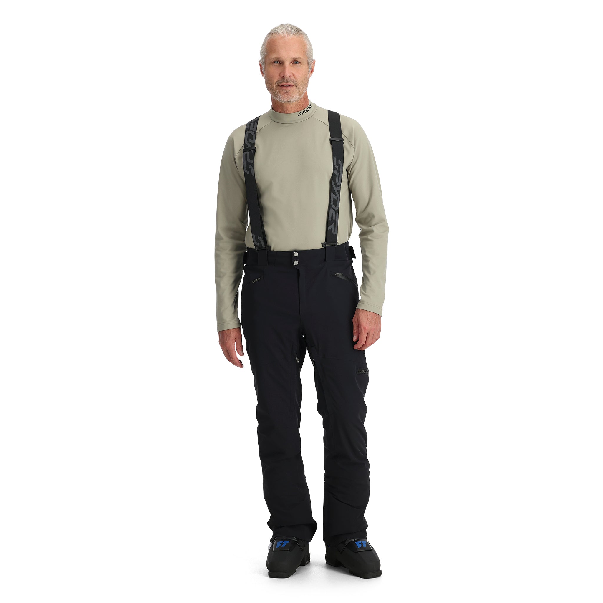 A man wearing a pair of black Spyder Bormio Ski Pants, which are waterproof, breathable, stretchable, and warm.