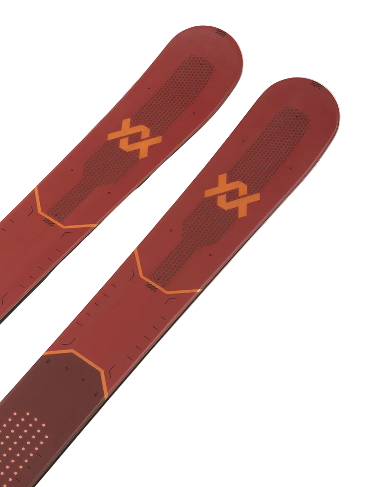 A pair of red and black 2027 Volkl Mantra Jr skis that are designed for all-mountain skiing.