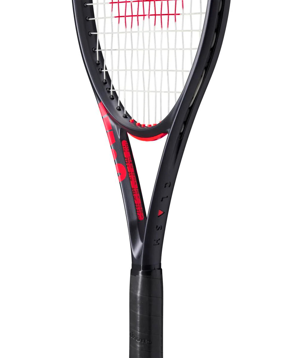 A Wilson Clash 100 high-perfomance versatile tennis racket that has a black frame and red accents.