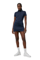 J.Lindeberg Women's Amelie Mid Golf Skirt, golf apparel, women’s golf skirt, stylish golf skirt, mid-length golf skirt, stretchy golf skirt, comfortable waistband, golf clothing, performance golf wear, Swiss Sports Haus, West Vancouver golf shop, women’s golf fashion, golf outfit.