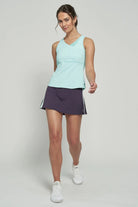 LIJA Elite Lily Tank, tennis tank top, tennis clothing, athletic wear, moisture-wicking tank, breathable mesh tank, stylish tennis top, fitted tank top, tennis gear, performance wear, Swiss Sports Haus, West Vancouver sports store.