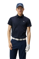 J.Lindeberg Men's Peat Regular Polo, golf polo, men's golf apparel, breathable polo shirt, moisture-wicking fabric, classic fit polo, stylish golf wear, golf clothing, casual wear, Swiss Sports Haus, West Vancouver golf shop, golf shirt, high-quality polo, J.Lindeberg polo, men's fashion.