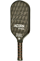 An ACORN EXTREME pickleball paddle with a black and gray geometric pattern on the surface, approved by USA Pickleball, with red and black handle.
