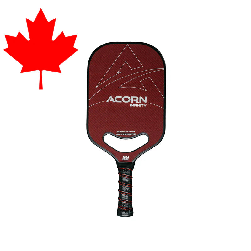 An Acorn Infinity pickleball paddle that highlights its red kevlar surface