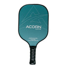 An Acorn Willow pickleball paddle that shows of the teal, black, and white colour scheme